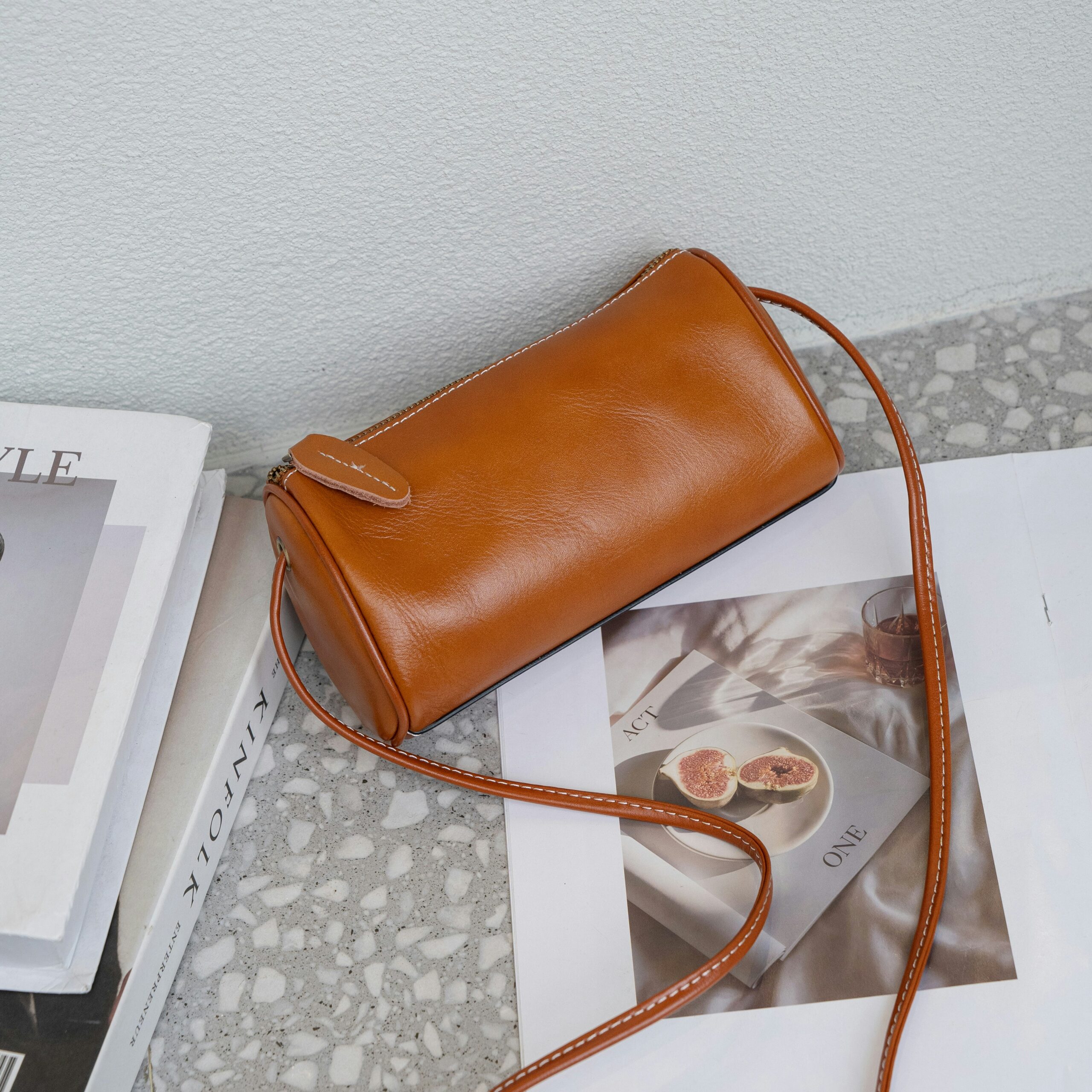 A brown purse sitting on top of a table